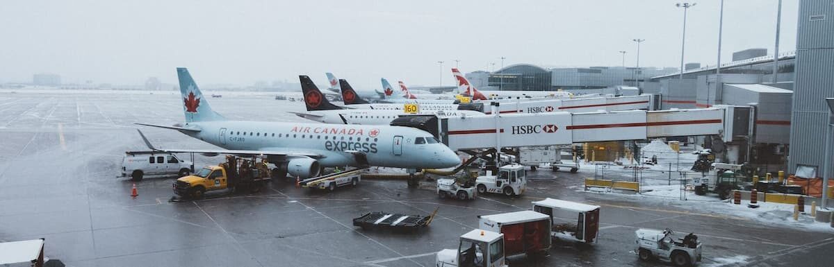 Canadian Express Entry - Airplanes connected to the bridge at Toronto Pearson international airport