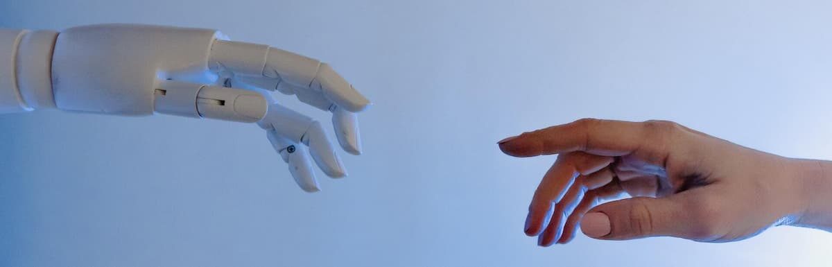 Person Reaching Out to a Robot. Study artificial intelligence at IU