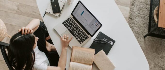 Easy Online Jobs for Students Abroad. Image of woman comfortably working from home.