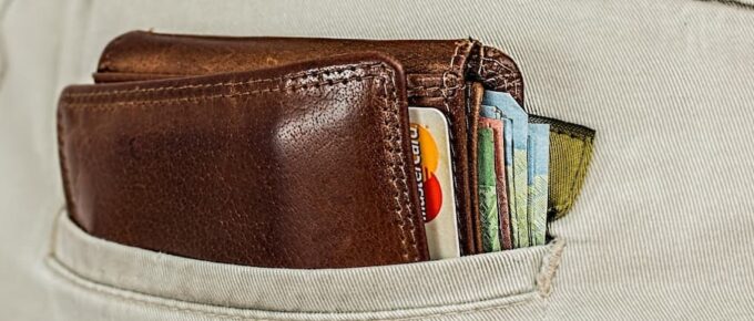 Resident Doctor Salary 2026. Wallet sticking out of backpocket