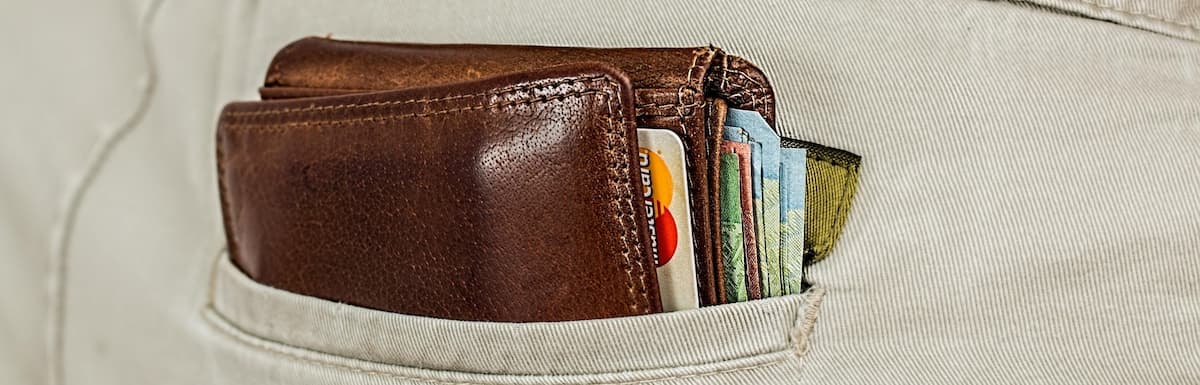 Resident Doctor Salary 2026. Wallet sticking out of backpocket